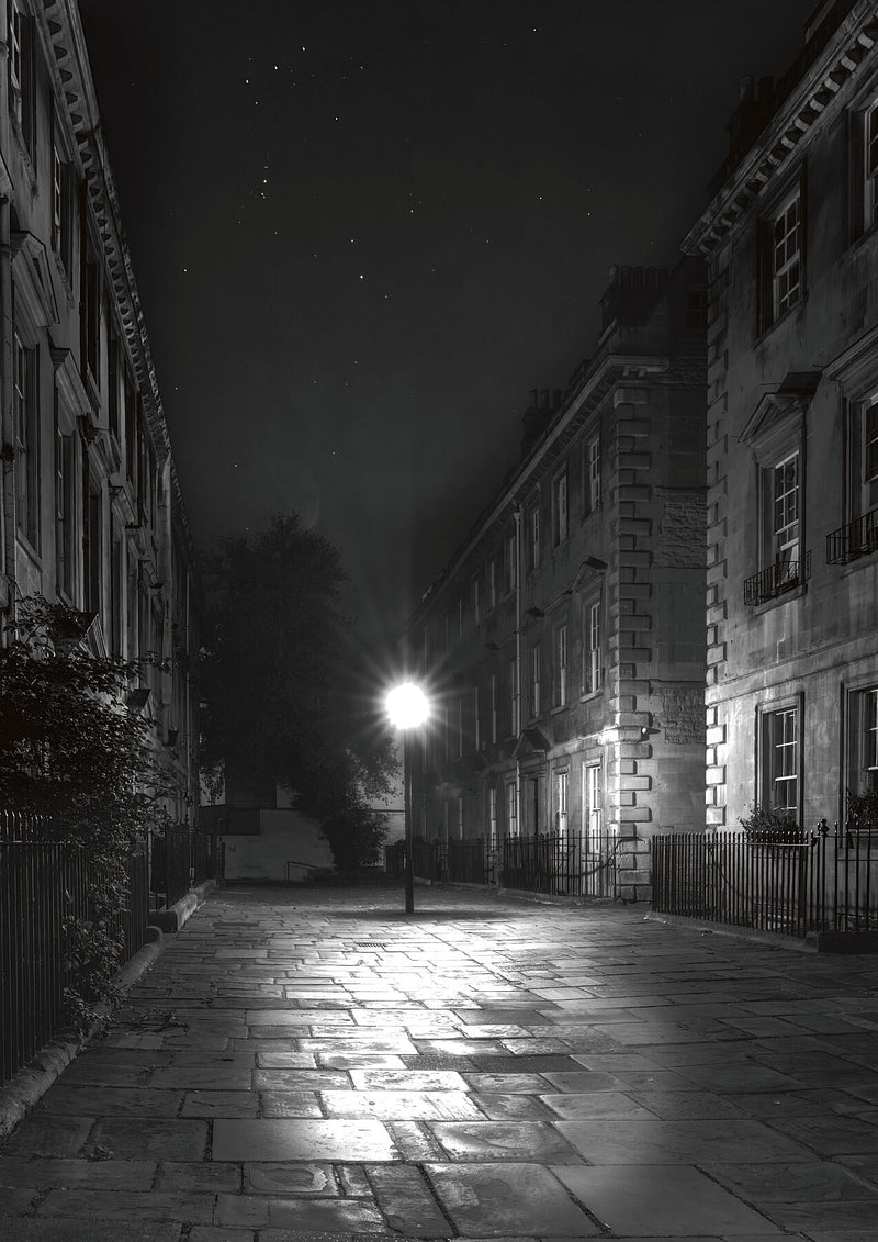 Quiet Elegance under the Streetlight in Bath, at night, in Bath, United Kingdom, with light on cobblestone