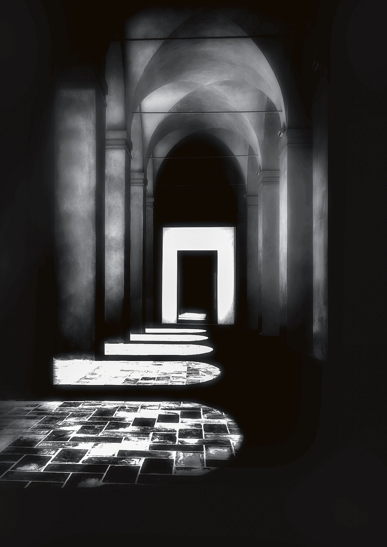 A colonnade in black and white in the Real Alcazar in Seville