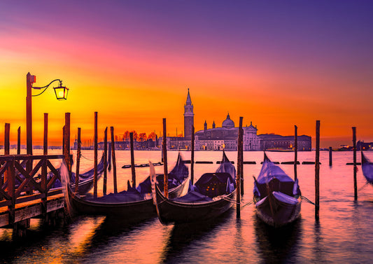 Gondolas at sunset and San Giorgio Maggiore in the background 