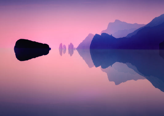 Panoramic fine art photograph of the Amalfi Coast at twilight with rock formations reflected on a calm sea under pink and violet light.