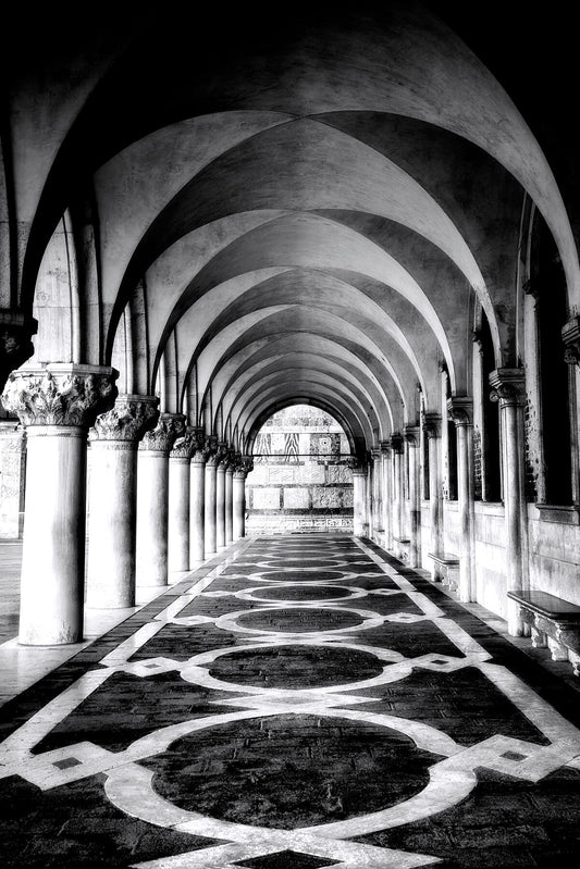 Monochrome photo of vaulted Venetian arches with geometric floor and soft light, fine art architectural symmetry