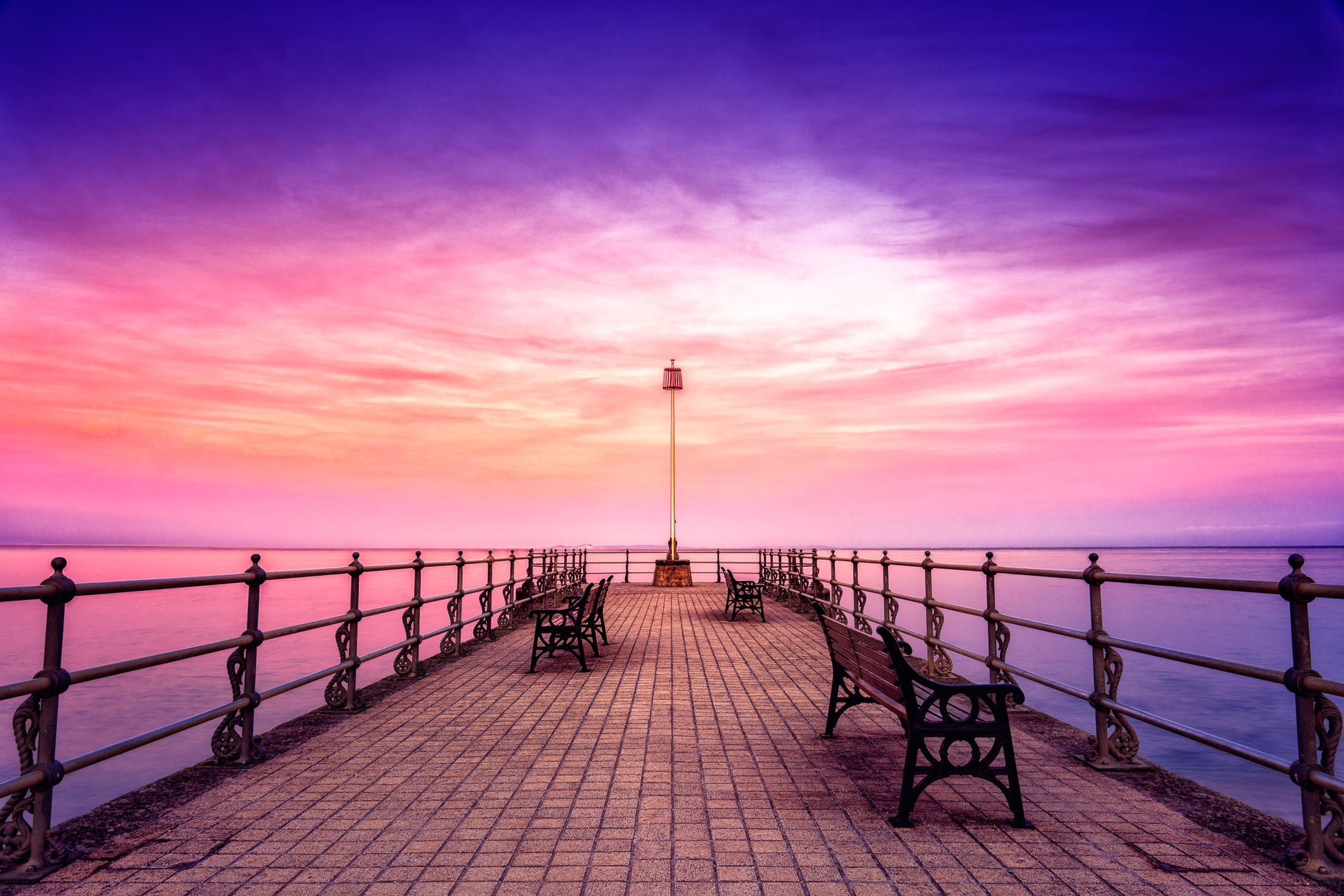Banjo Pier, at sunset, in Swanage, United Kingdom, with cool light