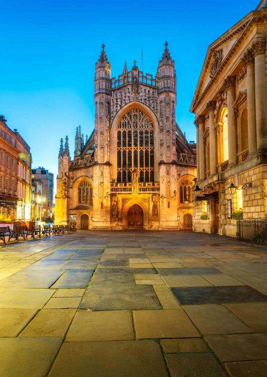 Bath Abbey at du
sk with illuminated stone pavement