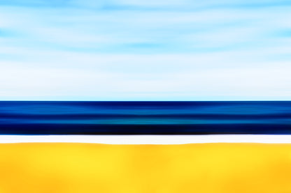 Abstract seascape with blurred bands of blue sea, pale sky, and golden foreground creating a minimalist coastal composition.