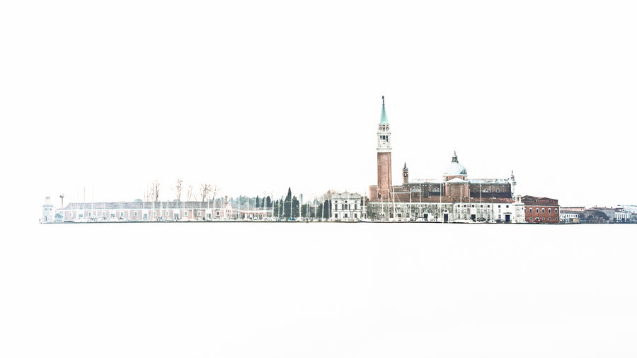 Minimalist colour photograph of San Giorgio Maggiore in Venice with church and bell tower isolated against white space