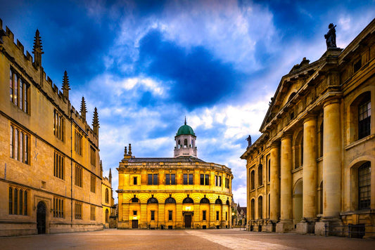 Oxford University's Sheldonian Theatre with a blue sky and clouds in the background