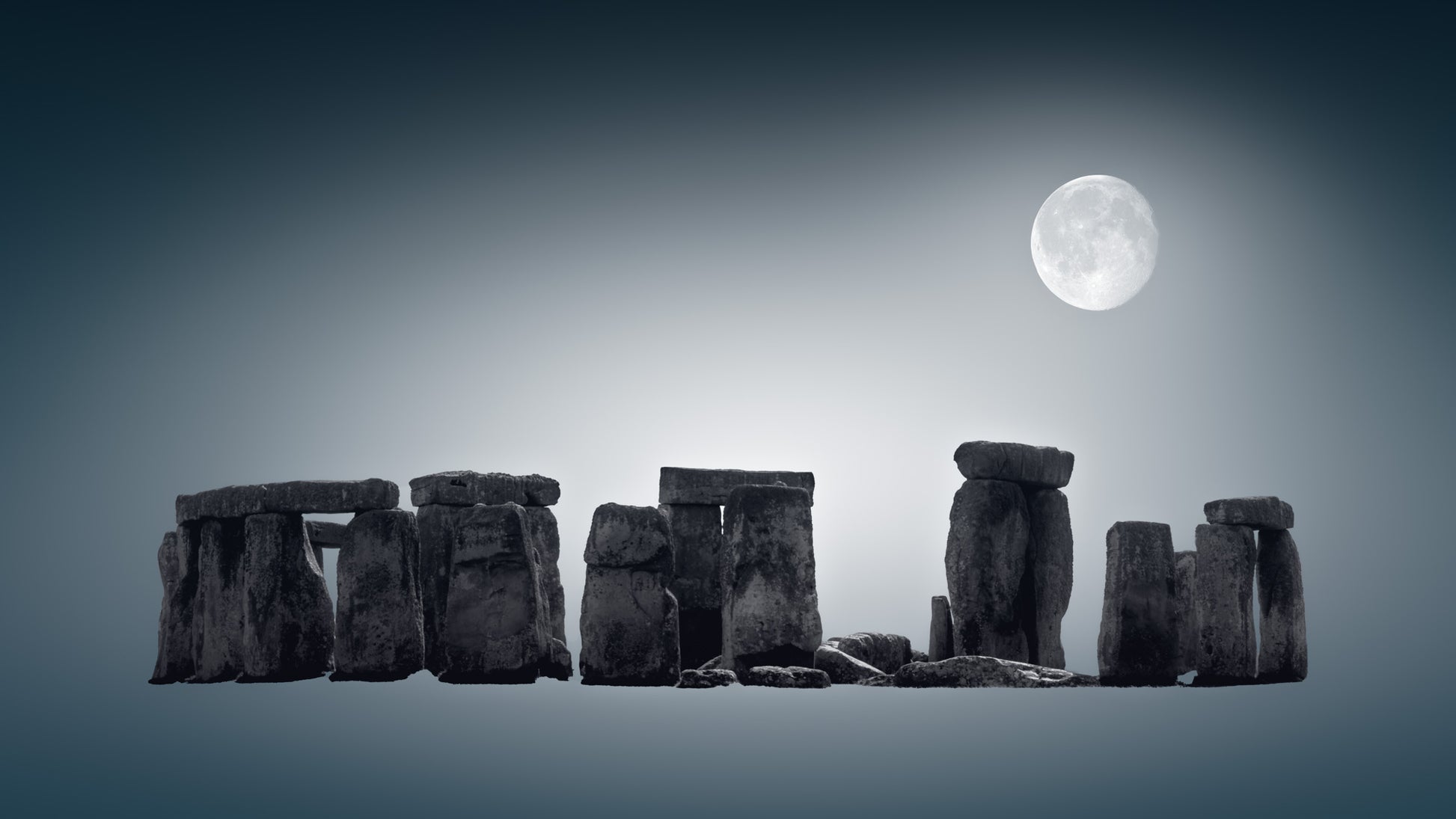 Stonehenge under a full moon on a dark blue background