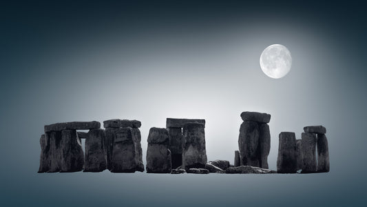 Stonehenge under a full moon on a dark blue background