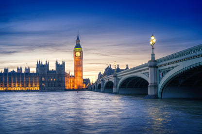 Colour photograph of Big Ben and Westminster at sunset with Westminster Bridge and the River Thames in London
