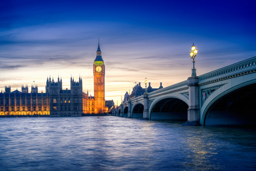 Colour photograph of Big Ben and Westminster at sunset with Westminster Bridge and the River Thames in London